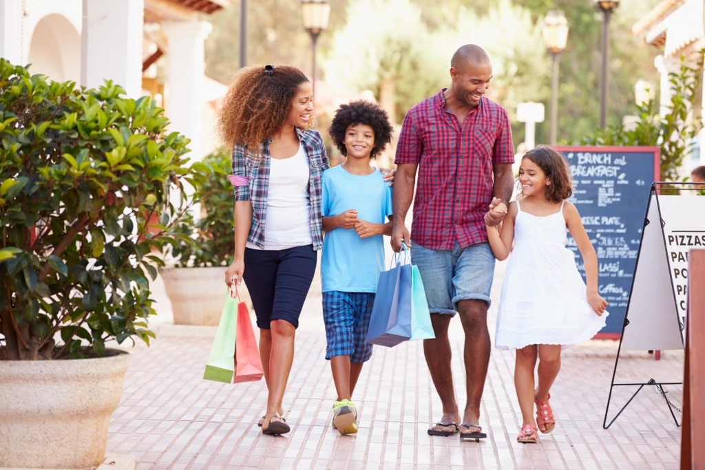 Family Shopping At Sunset