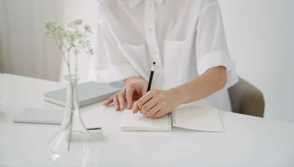 Woman Taking Notes Fixed Week Timeshares