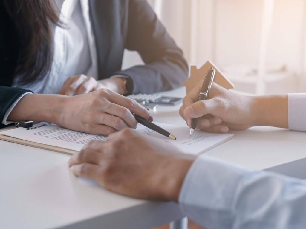 woman writing contract